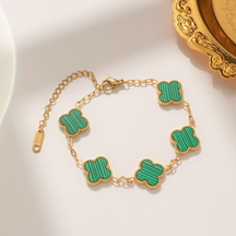 Pulseira trevo de quatro folhas com pérolas dupla face e cinco flores em aço titânio 18K que não desbota